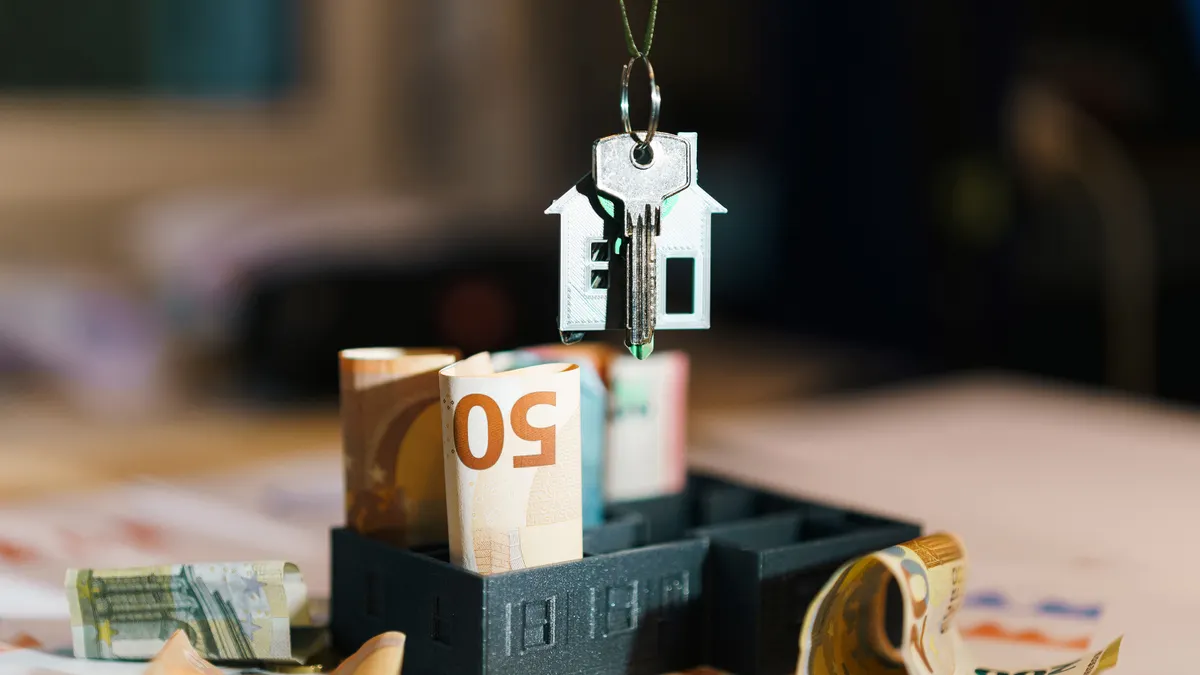 How Medicaid treats irrevocable trusts in elder care planning House-shaped keychain with cash and a box